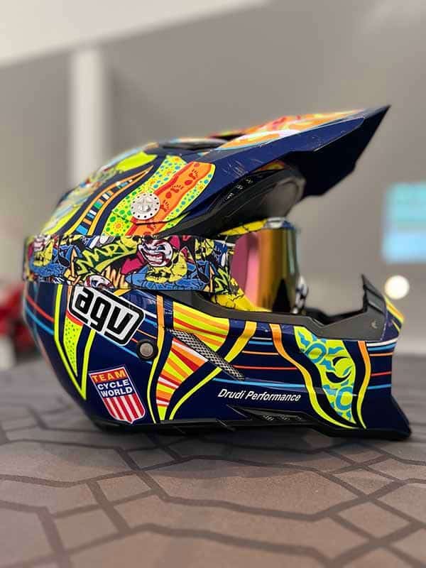 Black carbon Pista helmet, has orange stripe on