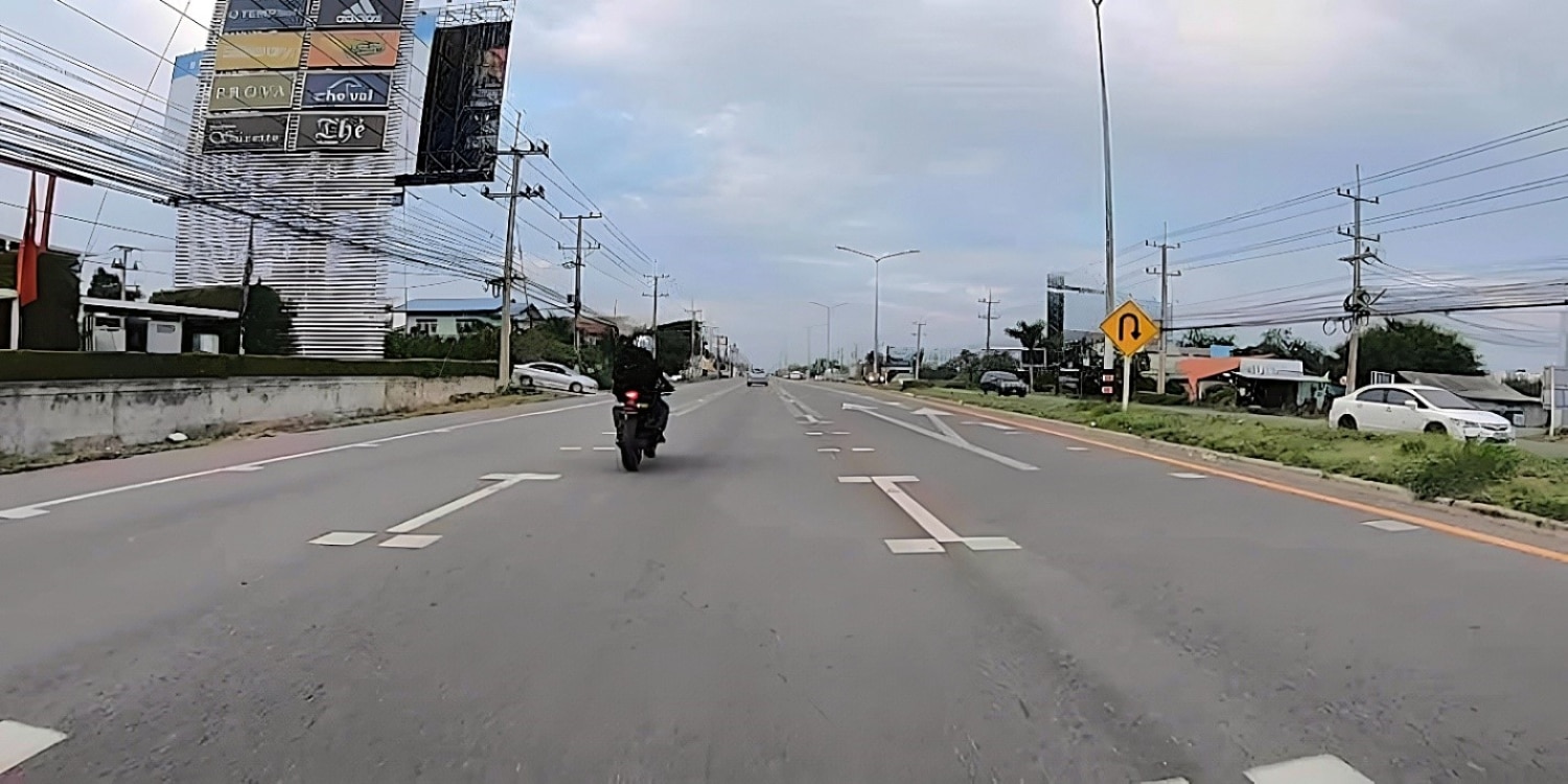 Michael Parrotte (Паротт Майкл), the founder of AGV Sports Group, heads south on Highway 1A, Lang Son, Vietnam on a clear afternoon with the sun shining bright. The higher speed limit on highways, freeways and expressways may seem perilous but limited access, low-to-no pedestrian presence, no slow-moving vehicles, and separation of traffic by a meridian reduces potential hazards for riders.