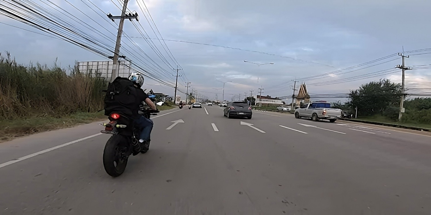 Michael Parrott follows safe riding practices by riding down the middle of the left-most lane (the safest place to ride a motorcycle) on the multi-lane Highway 1A from Lang Son to Ca Mau. As a rule of thumb, always ride in the leftmost portion of your current lane to remain visible and flexible with your escape options should something pop up ahead. Keep your distance and composure, always thinking about the next move and anticipating what other drivers ahead and behind you might want to do next. Failure to yield is a leading cause of fatal crashes among motorcyclists. Stay out of other drivers’ blind spots and constantly check your own (feel free to glance backwards) before merging and changing lanes.