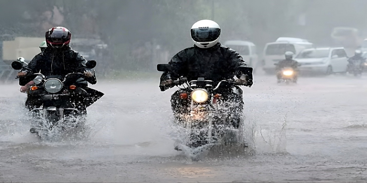 Navigating flooded urban streets in Borongan, Philippines, on small displacement bikes. In the background, other vehicles seem to pass wherever there is room disregarding road markings, which are currently submerged. To avoid stalling a small displacement bike when chugging through a foot of water, you need to master smooth clutch control to keep the revs up and the engagement in the friction zone.