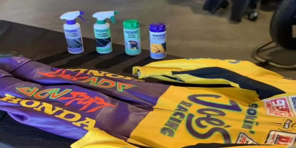 A racing suit, along with a few cleaning products, is ready for a thorough cleaning and conditioning, which should typically be done once, or at most, twice a year.