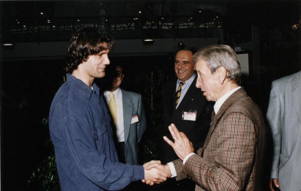 On the right, in a brown striped suit, you can see Gino Amisano.