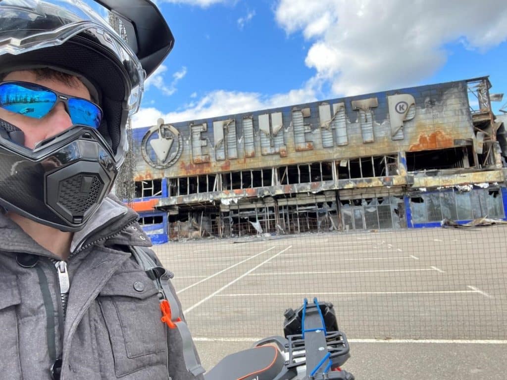 Top 5 Best Carbon Fiber Helmets Last fall in Bucha, Ukraine, I’m standing in front of Epicenter (similar to Ukrainian Home Depot), next to my Tekken 250 Adventure Touring bike, wearing my AGV AX9 Carbon helmet with the visor open and my glasses on.