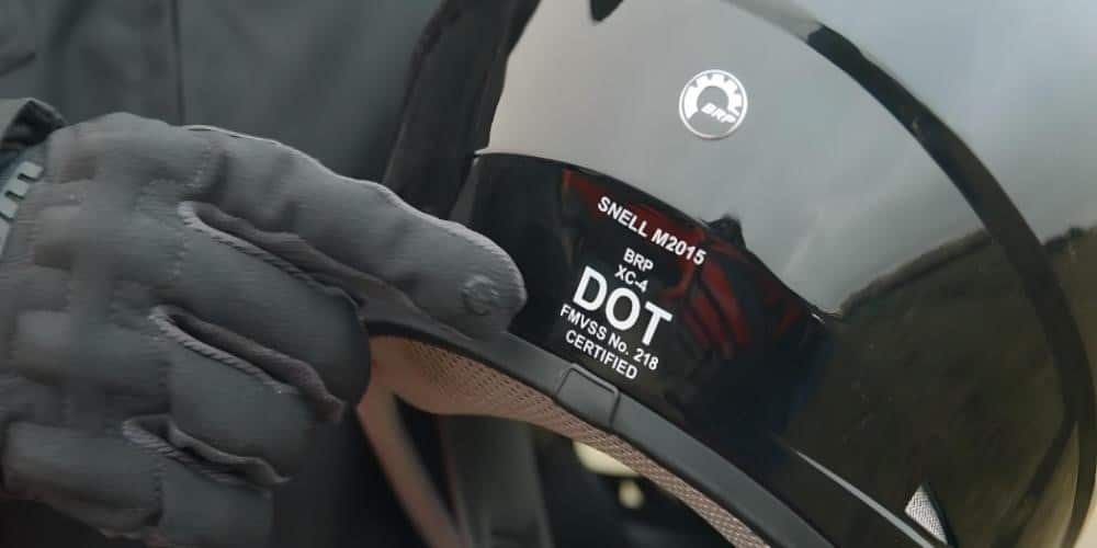 How to Check a Helmet's Quality: The 6 Key Pillars a helmet with safety certifications displayed on the back, including labels and markings indicating compliance with safety standards.