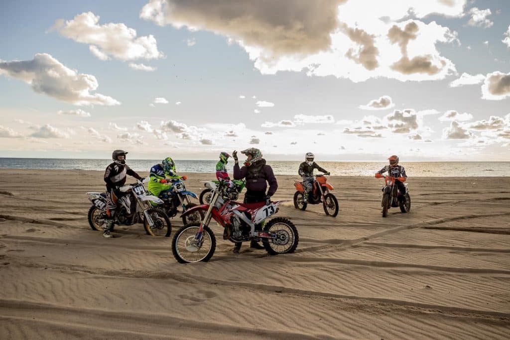 Pausing the enduro adventure: taking a moment to enjoy the beachscape.