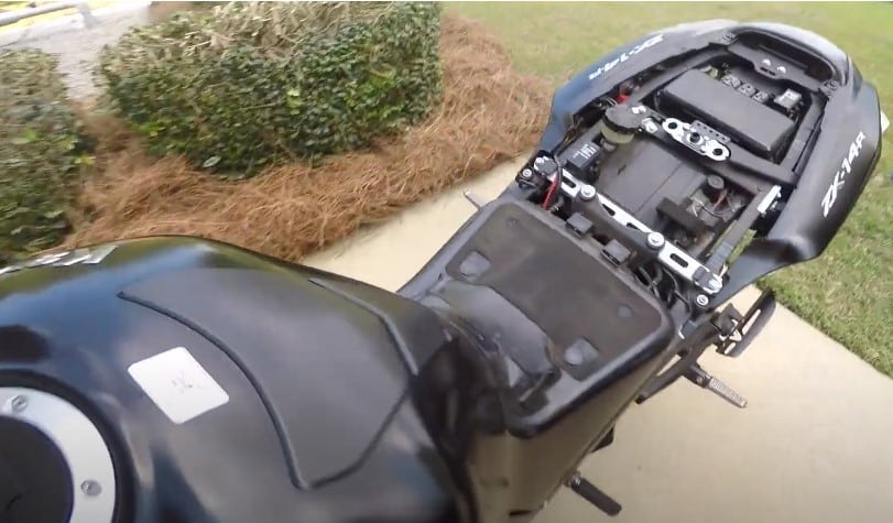 Exploring the underside of a sport bike rear cowl. Most of the electrical components can be tucked away safely and out of sight but the battery will certainly give you a run for your money.