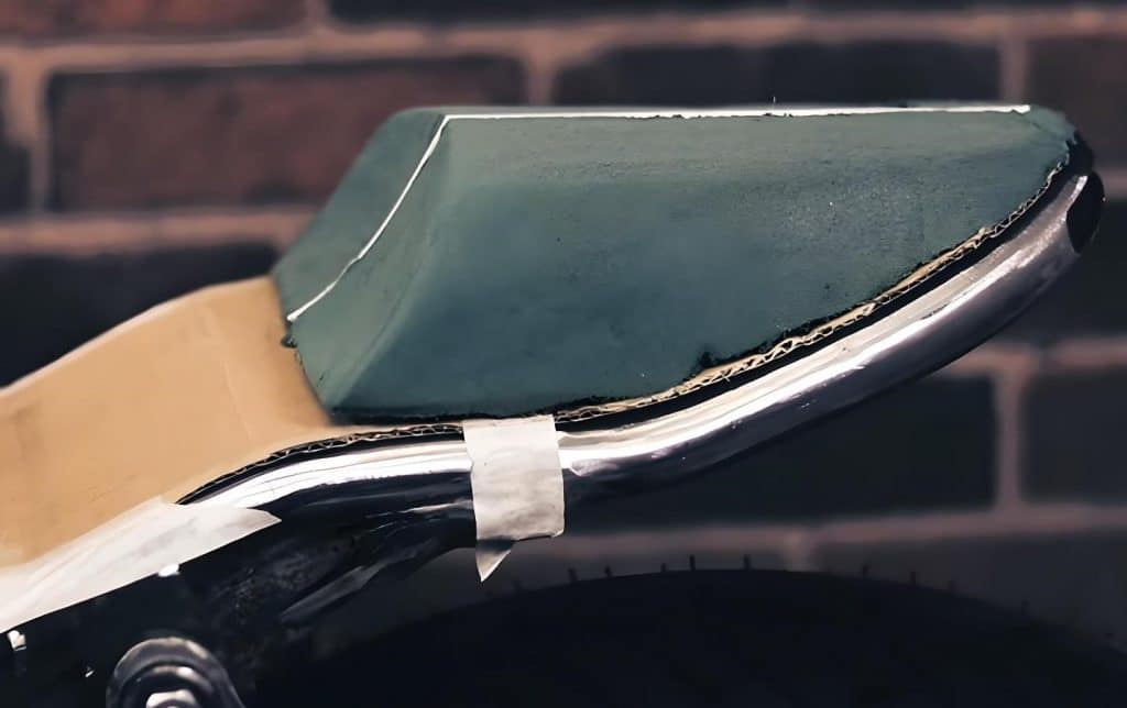 Making a DIY fiberglass seat cowl is a work of art. Mostly a trial-and-error process of trying on different shapes of mold and layering. And we cannot tell how good it will look without first finishing it.