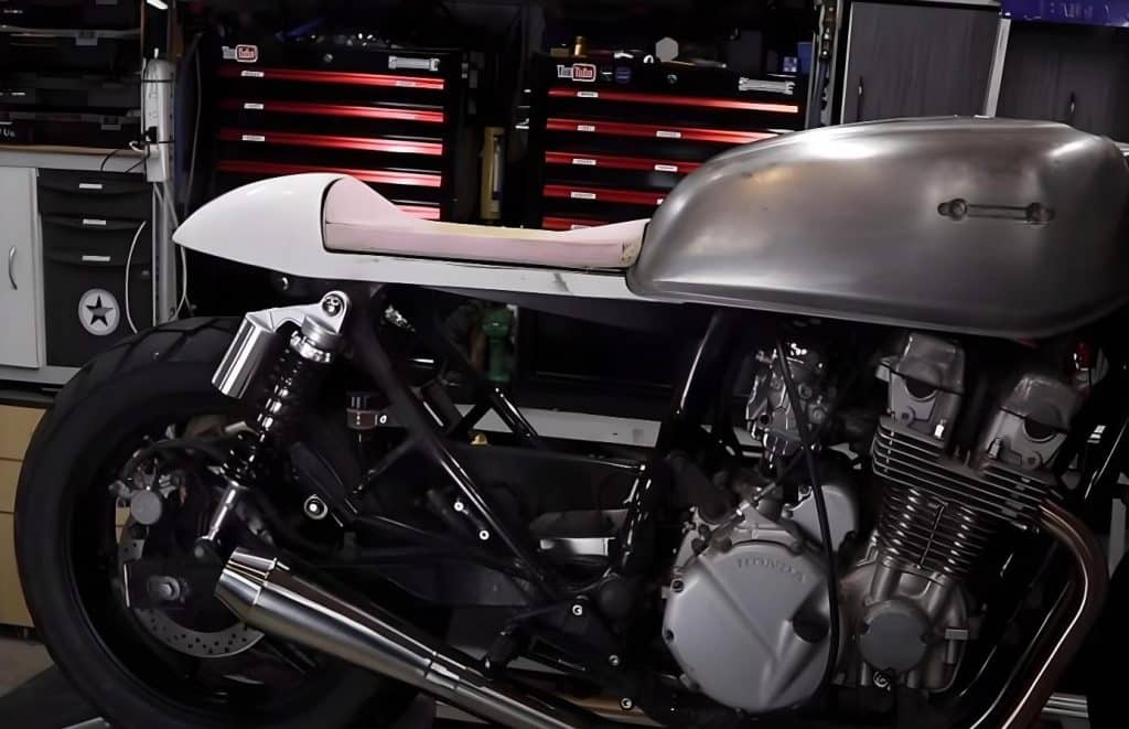 Shaping the foam on a plastic seat pan for the Honda CB750 Cafe Racer. Using various layers and densities of foam will help you achieve the perfect shape with durable results.