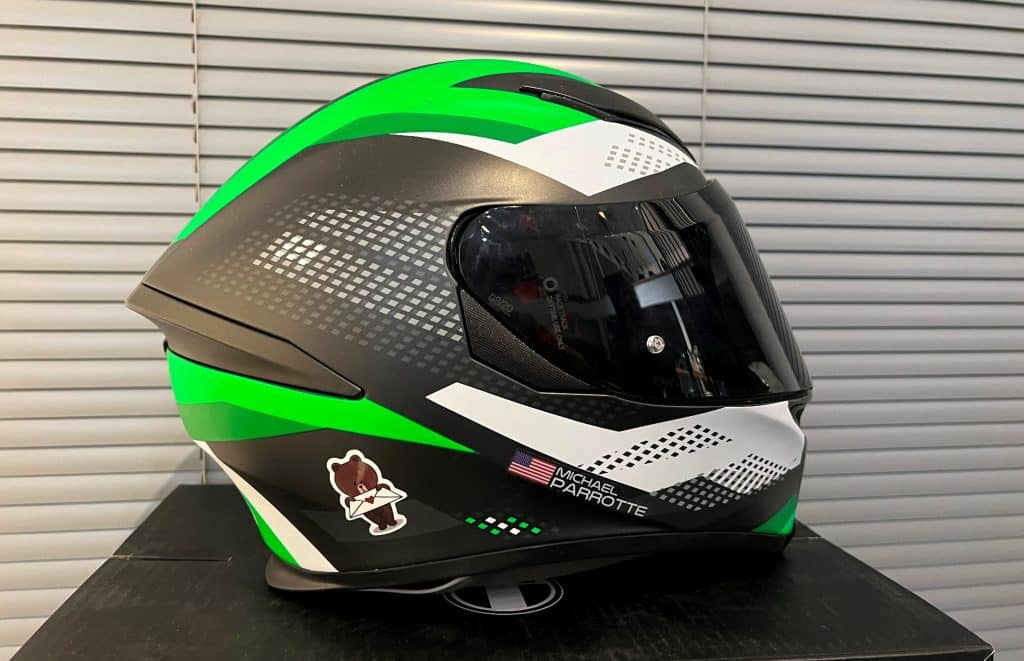 Is White Helmet Better Than Black? Loud Colors Save Lives My AGV K5 helmet in Kawasaki colors – featuring a combination of classic black, high-visibility white, and vibrant green – is prominently displayed on top of its packaging box in my Maryland office. These distinct colors highlight the balance between style and safety, with white ensuring visibility and green adding a pop of vibrancy