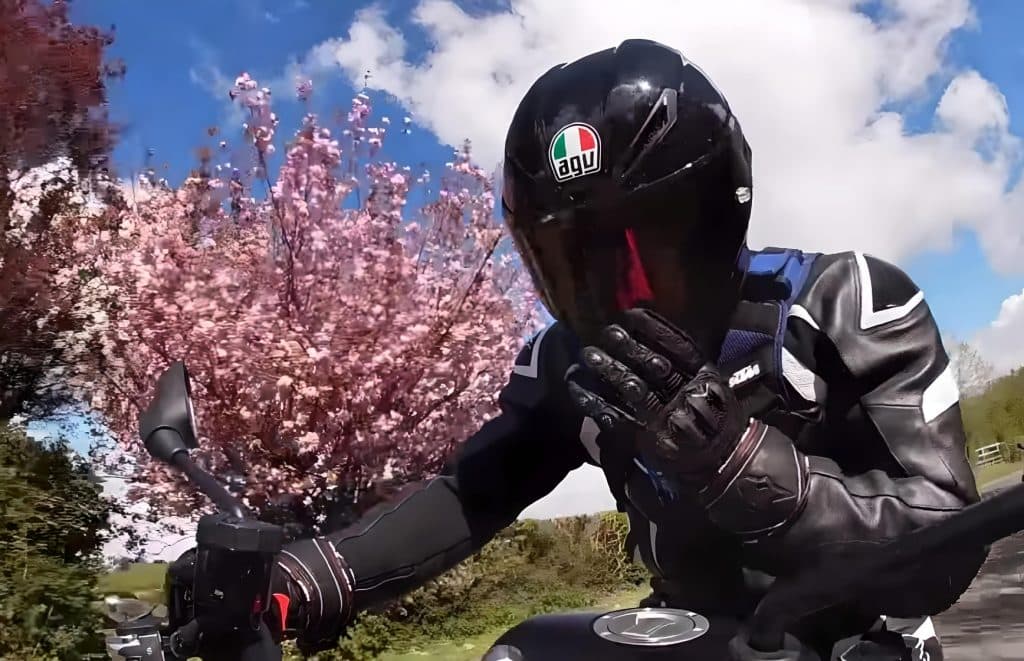 Top 7 Best Helmets for Naked Motorcycles Securing the AGV K6 visor in place before adjusting the chin vent. Initially, it might be a bit tricky with gloves on, but after getting used to its mechanism, it becomes much easier to operate.