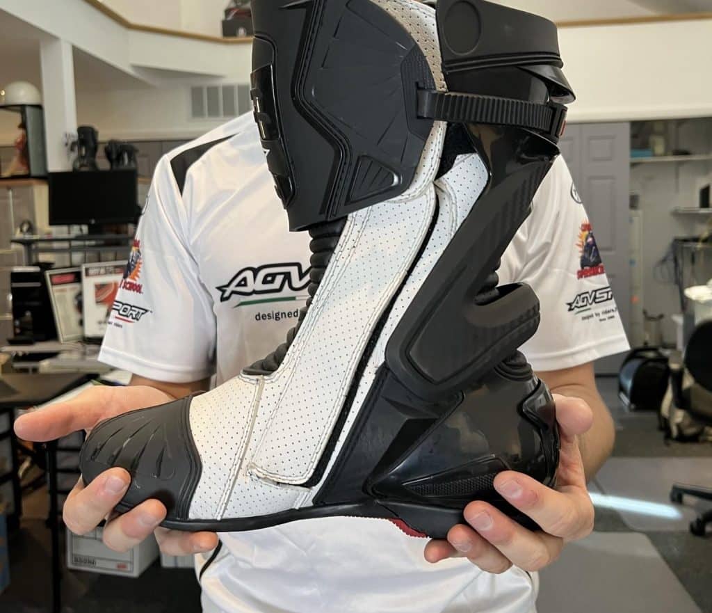 Do You Need Tall Motorcycle Boots? Explore the Pros and Cons Triple closure with zippers, a velcro strip and further secured with a ski-boot style ratcheting strip at the top to ensure a secure and positive closure.