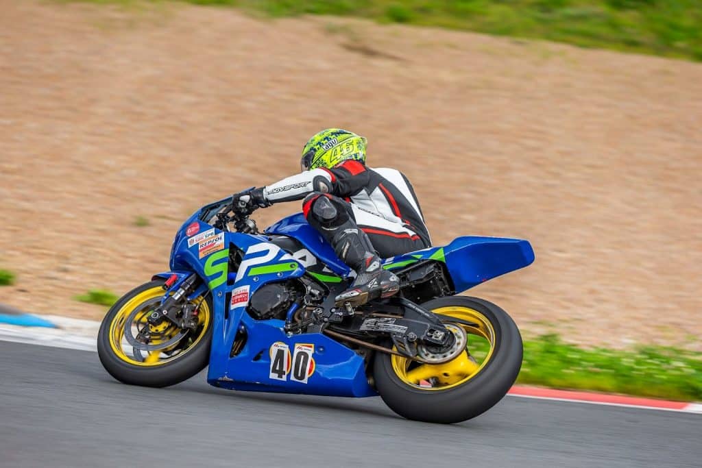 Denis Grachev Hanging off the bike for corner entry at the Pertamina Mandalika International Street Circuit in Lombok, Indonesia. The grippy inner side of the boot holds the bulk of your weight firmly on the bike. 