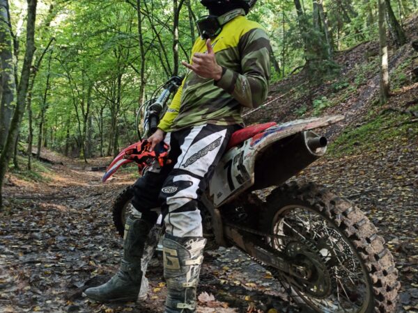 A quality off-road tire for sand, mud, and loose terrain typically features knobby lugs resembling a paddle design