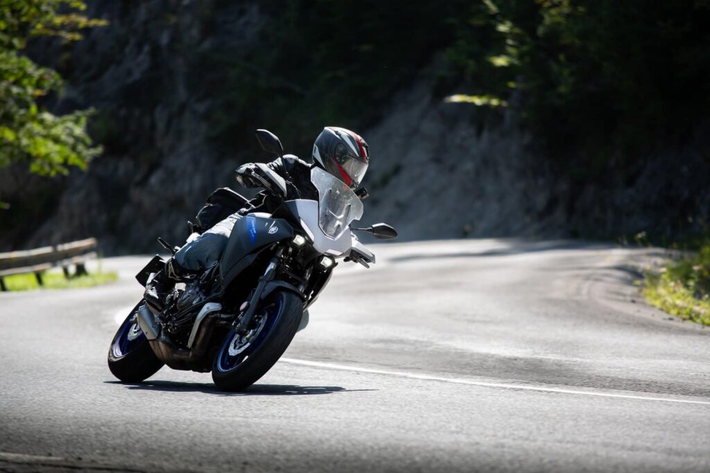Is Riding a Sportbike Uncomfortable? My 8 Pro Tips for a Better Ride! Gracefully leaning on a corner at Deals Gap, the mountain pass weaving through Tennessee and North Carolina, atop the Yamaha MT-07 Tracer 700.