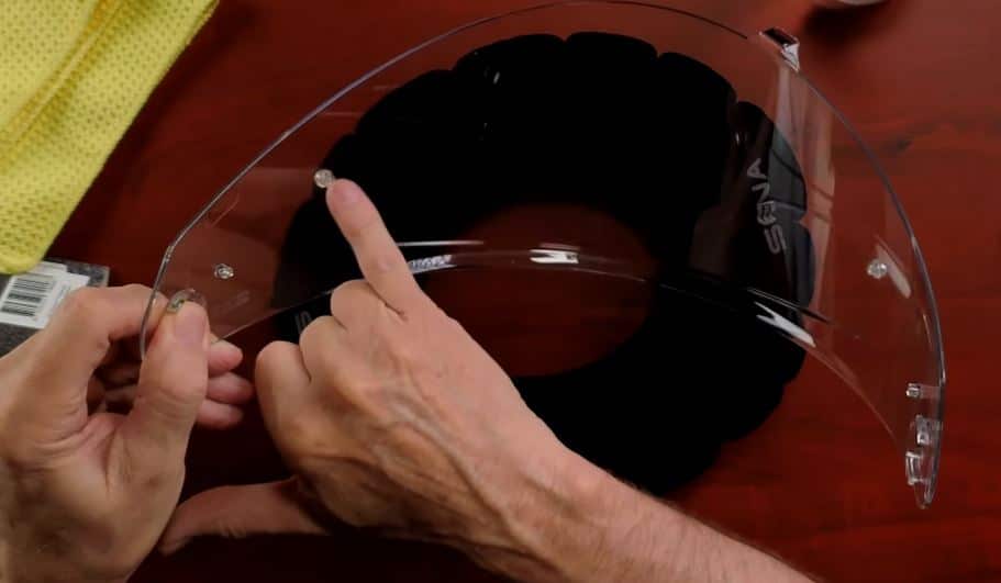 The Pinlock pins are on the inside of the Sena Impulse's face shield. To install the Pinlock Fog Resistant (Clear) 120, gently open the shield and take it off the helmet. Check that the Pinlock attachment points face outwards, and clean the inside of the shield with a dry cloth. Carefully bend the Pinlock lens and slide it between the two attachment points on the shield, making sure the sealed side touches. After that, peel off the protective film from the Pinlock. Finally, put the face shield back on the helmet securely.