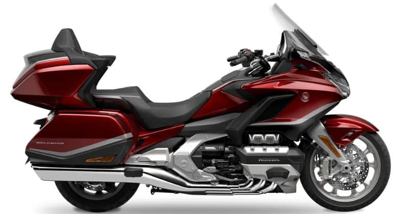Which Heavyweight Motorcycles Have Reverse Gear? Top 6 Picks The wine-red Honda Goldwing Tour equipped with an electric reverse assist system. The reverse gear feature, activated via a button on the left handlebar, is essential due to its 357 kg (787.1 lb.) weight, making reversing easier