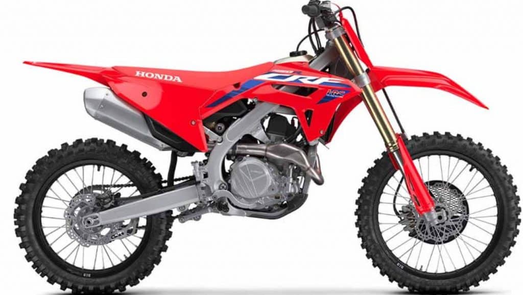 2024 Honda CRF-450R with an overall length of 85.9 inches, width of 32.6 inches, and height of 49.9 inches. Features a ground clearance of 13.2 inches, seat height of 38.0 inches, and a wheelbase of 58.3 inches.