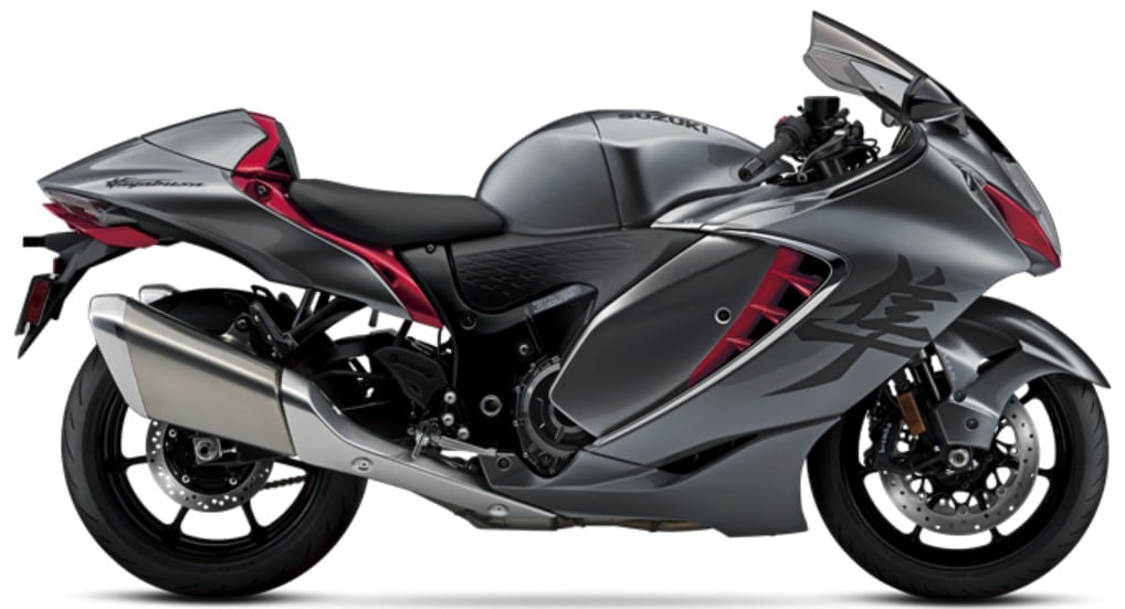 The 2024 Suzuki Hayabusa in Metallic Thunder Gray & Candy Daring Red with a 58.3-inch wheelbase, 4.9-inch ground clearance, and 31.5-inch seat height.