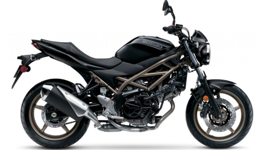 2024 Suzuki SV650 ABS in Glass Sparkle Black, featuring an overall length of 84.3 inches, width of 29.9 inches, and height of 42.9 inches. Includes a 56.9-inch wheelbase, 5.3-inch ground clearance, and a 30.9-inch seat height.