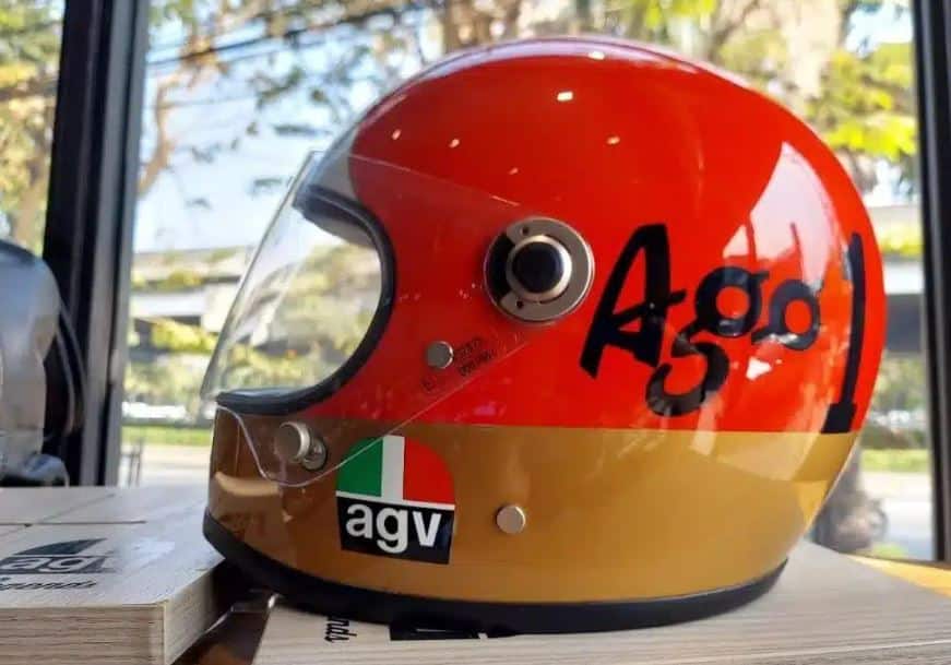 AGV Helmets: Price, Buy, Models, Parts, Warranty, Shipping, Returns & More AGV X3000 "Ago 1" fiberglass motorcycle helmet featuring a retro racing design and a strong, lightweight fiberglass shell for durability and impact protection.