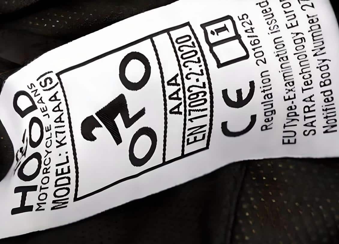 A logo on motorcycle jeans displaying the EN 17092-2:2020 standard, which outlines general requirements for Class AAA protective garments for motorcyclists.