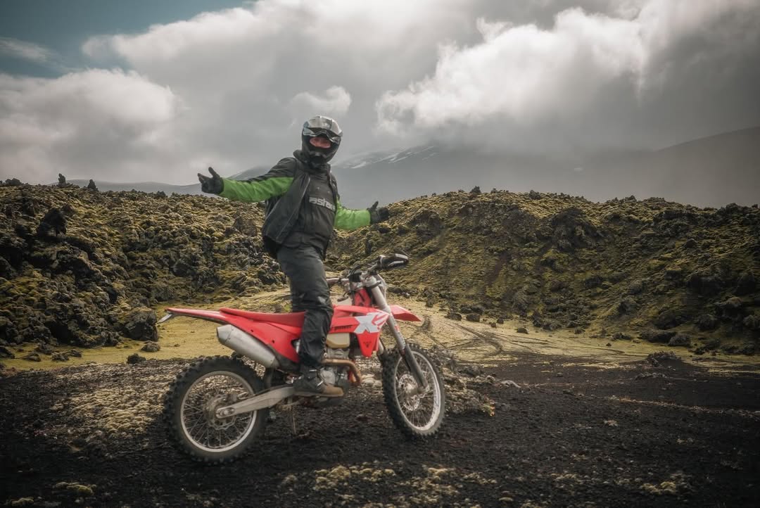 Pausing on a high-elevation ridge overlooking Vietnam’s dramatic off-road landscape on an untamed trail