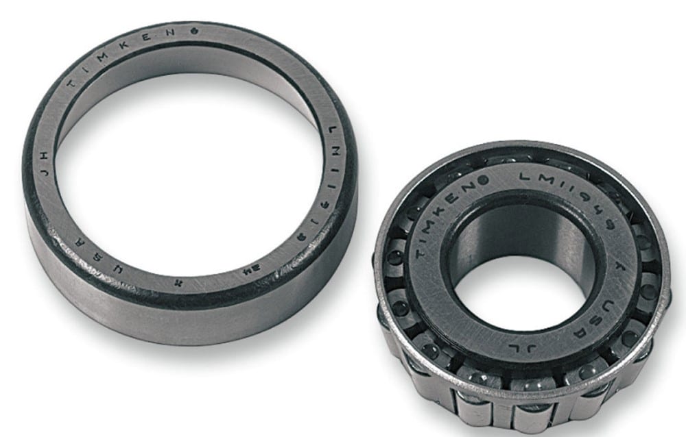 A tapered roller bearing cone and race (Timken style) as used in some motorcycle wheel hubs. The conical rollers handle high radial and axial loads but require proper preload and greasing.