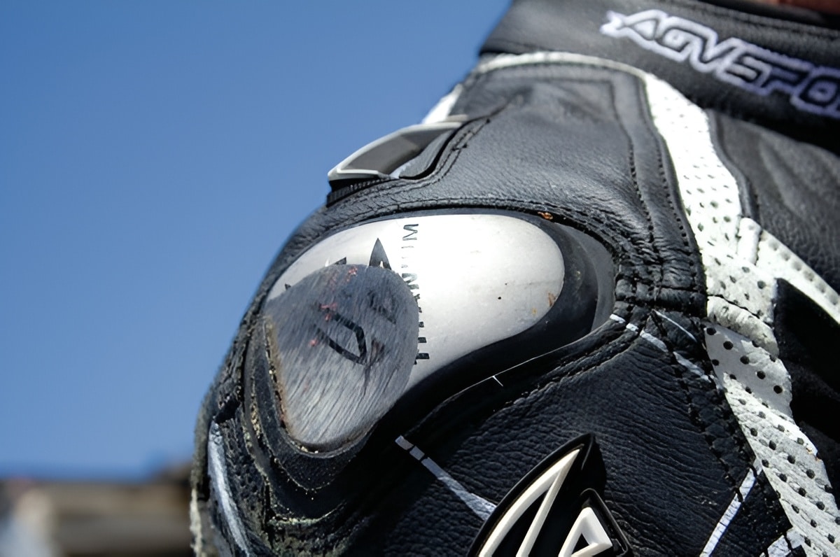During a fall at speed, the shoulder pads of my AGVSPORT racing suit got scratched from sliding against rough asphalt.